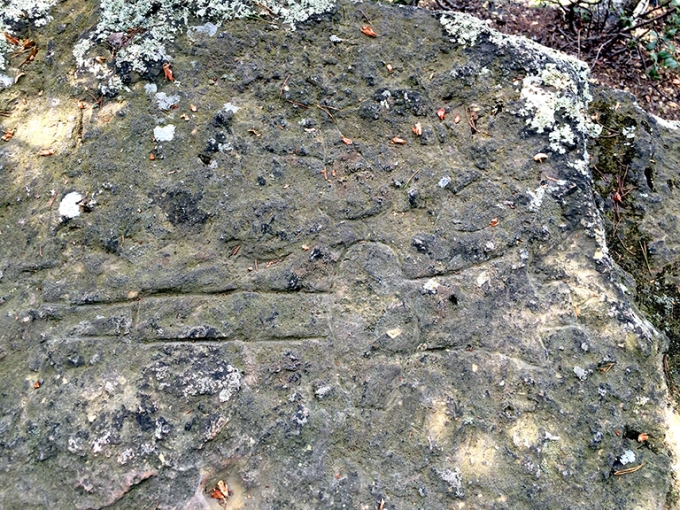 The Mace Bluff petroglyph. The mace is considered to be a symbol of authority and restricted to ceremonial uses.